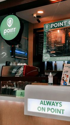 the front counter of point cafe with menus on display