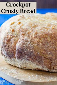 a close up of bread on a cutting board with the words crockpot crusty bread