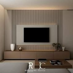 a modern living room with a flat screen tv on the wall