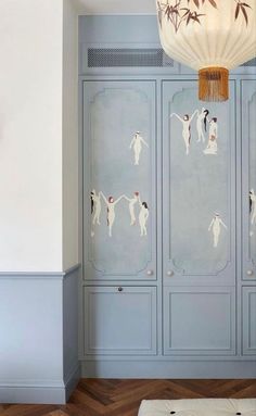 a room with blue cabinets and white walls