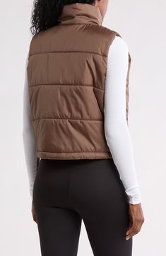 Whether you're deep in the back country or just your own backyard, you'll appreciate the core warmth of this vest filled with cozy insulation. Front zip closure Stand collar Front welt pockets Lined, with polyester fill 100% polyester Machine wash, tumble dry Imported Fitted Nylon Puffer Jacket For Outdoor Activities, Fitted Puffer Vest For Outdoor, Fitted Outdoor Puffer Vest, Winter Athleisure Vest For Outdoor Activities, Fitted Casual Puffer Jacket For Outdoor Activities, Brown Nylon Outerwear For Outdoor Activities, Brown Casual Puffer Jacket For Outdoor Activities, Casual Brown Puffer Jacket For Outdoor Activities, Fitted Brown Outerwear For Outdoor Activities