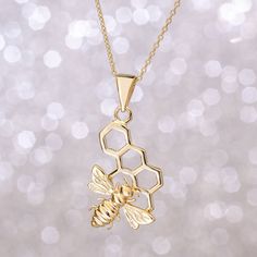 "Honeycomb and Bee Gold Necklace, Bee on Honeycomb 14k 18k Solid Gold Necklace, HoneyComb Bee Pendant Necklace, Anniversary Gift, Valentine's Gift. Nature Necklace / Honeybee Necklace The material is 14k solid gold (not gold filled or gold plated). Chain Length - 16 inches adjustable 15 inches (choker) Chain Length - 18 inches adjustable 16 inches Chain Length - 20 inches adjustable 18 inches Chain Length - 22 inches adjustable 20 inches We put an additional adjustment ring on the necklace to us Bee On Honeycomb, Honeycomb Necklace, Choker Chain, Bee Jewelry, Nature Necklace, Bee Pendant, Solid Gold Necklace, Bee Necklace, Valentine's Gift