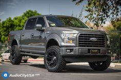 a large gray truck parked in a parking lot