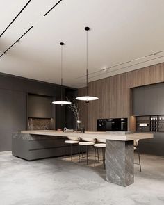 a modern kitchen with marble counter tops and an island