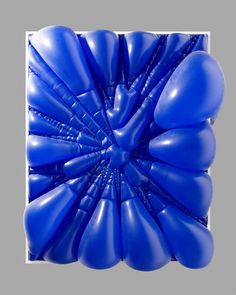 blue balloons are arranged in the shape of a flower