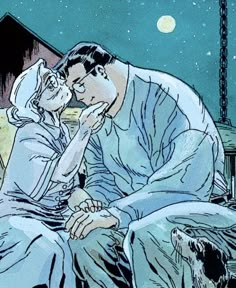 an image of a man and woman kissing in the night