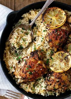 chicken with lemons and rice in a skillet