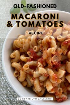 a white bowl filled with macaroni and tomato sauce on top of a table