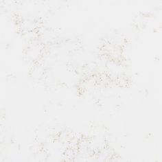 a white marble background with some brown speckles on the top and bottom half