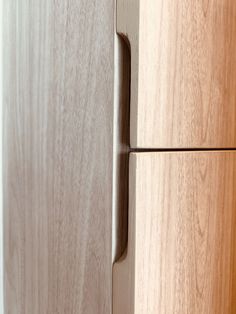 a close up view of a wooden cabinet door