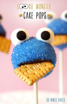 cookie monster cake pops on a stick with eyes and mouth made out of graham's crackers