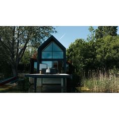 a small house sitting on top of a lake