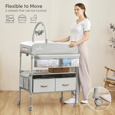 a woman standing next to a baby crib and changing table with drawers on it