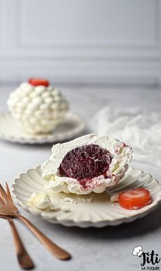 two plates with desserts and forks on them