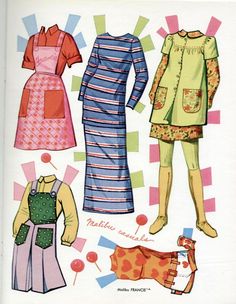 an image of paper doll clothes on display