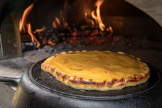 there is a pizza cooking in the oven