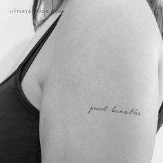 a woman with a tattoo on her arm that says, i got beautiful written in cursive writing