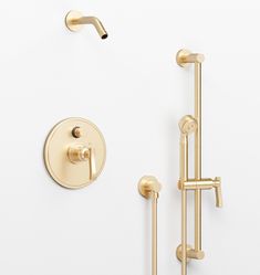 an image of a bathroom setting with shower faucet and hand shower head in gold