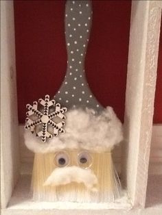 a close up of a toothbrush with a mustache and snowflakes on it