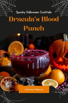 a halloween drink with oranges and cranberries in the background text reads spooky halloween cocktails dracula's blood punch