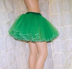 "The main fabric is soft Green Bridal Tulle. The waistband is matching green cotton over elastic. Then I finished it off with bright white piping on the hem. This skirt is stitched and serged to last a lifetime. It's safe for the washing machine and the dryer. Measurements: Waist Size Small: 24\" to 32\" Medium: 33\" to 42\" Large: 42\" to 50\" Length: 14\" NOTE This listing is only for the green piped tulle skirt. This skirt is made to order, please allow some time to create it. If you are on a Costume Tutu, Crinoline Skirt, Tutu Costumes, Green Cotton, Green And White, Bright White, Piping, Tulle Skirt, Ruffles