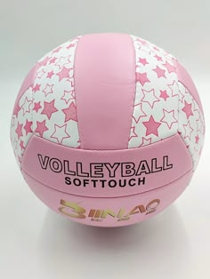 a pink and white volleyball ball with stars on it