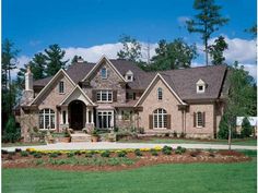 a large brick house with lots of windows