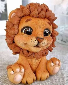 a lion figurine sitting on top of a table