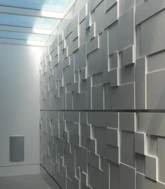 an abstractly designed wall in the middle of a room