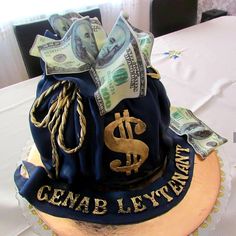 a cake that has money on top of it