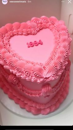 a heart shaped cake sitting on top of a white plate