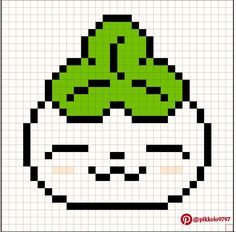 an image of a pixellated face with a green leaf on it