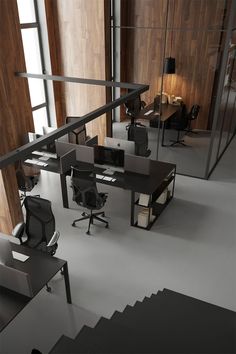 an office area with desks and chairs