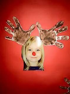 a child's hand and face are shown with their hands painted to look like clowns