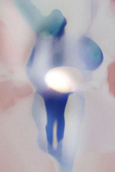 a blurry image of a person holding a toothbrush