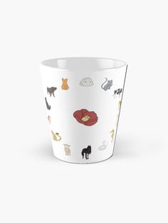 a white cup with cats and dogs on the inside, in front of a white background