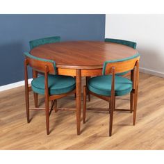 a wooden table with four chairs around it