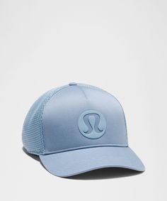 a light blue hat with the letter u on it