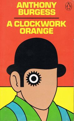 an orange and black book cover with a man's face in the middle of it