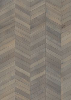 an image of a wood floor pattern that looks like herringbones