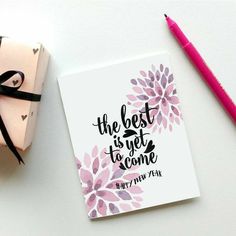 the best is yet to come happy new year card with pink flowers and black ribbon