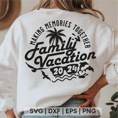 a woman wearing a white sweatshirt with the words making memories together family vacation on it