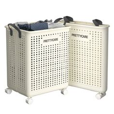 two white laundry baskets with black handles on each side and the words pretticare printed on them