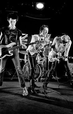 a group of young people playing instruments on stage