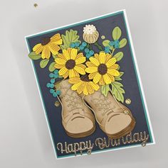 a handmade birthday card with sunflowers and boots