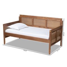 the bed frame is made from wood and has white sheets on it, along with a pillow