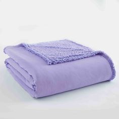 a purple blanket is folded up on a white surface with the words amethyst written below it