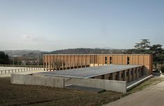 the building is made out of concrete and wood