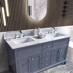 a double sink vanity in a bathroom with marble counter tops