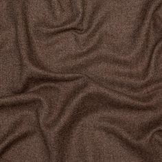 an image of a brown fabric textured with some sort of clothing or material